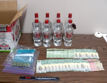 Here's a look at the vodka, weed and cash seized May 13 in Cambridge Bay. (PHOTO COURTESY OF THE RCMP)