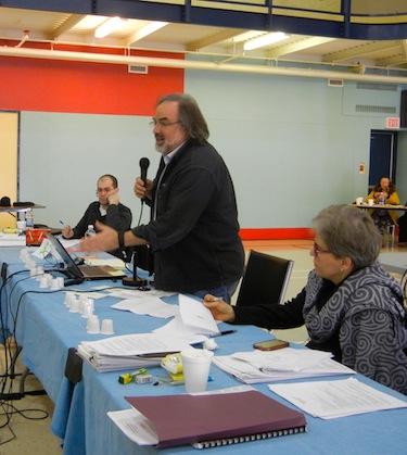 Researcher Gérard Duhaime, standing, talks to Kativik Regional Government councillors May 28 at their meeting in Kangiqsujuaq. (PHOTO BY JANE GEORGE)