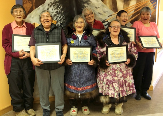 Cambridge Bay elders pose April 29 with certificates recognizing them as master teachers or Innait Inuksiutilirijit: Mabel Etegik, Annie Atighioyak, Mary Kaniak, Margaret Okhina, and in the back row, Amy Kamoayok, Susie Maniyogina, Susie Koaha. Read more later about the event on Nunatsiaqonline.ca. (PHOTO BY RED SUN PRODUCTIONS)