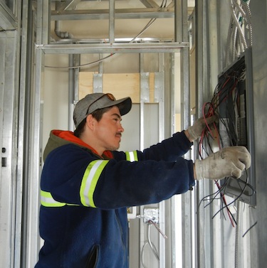 As the electrician on the project to wire Kuujjuaq's future suites hotel, Daniel Gadbois says he needed to make sure every part of the work was up to the stringent codes established for such a structure. (PHOTO BY JANE GEORGE)