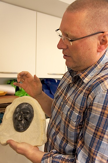 Geir Klover, the director of the museum, holds a piece of art from Gjoa Haven — the museum wants to serve as an outlet for the community's artists. (PHOTO BY ALEX BOYD)