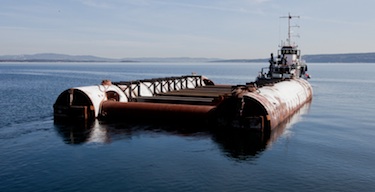 Here's the Tandberg Polar tugboat pulling the custom-designed pontoon barge on which the Maud Returns Home project wants to tow back the Maud from Nunavut to Norway. (PHOTO COURTESY OF MAUD RETURNS HOME)