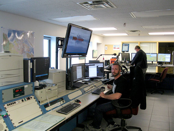 Officer Louis Robert of the Canadian Coast Guard helps direct Arctic sea traffic at the Marine Communications and Traffic Services office in Iqaluit. (PHOTO BY PETER VARGA)