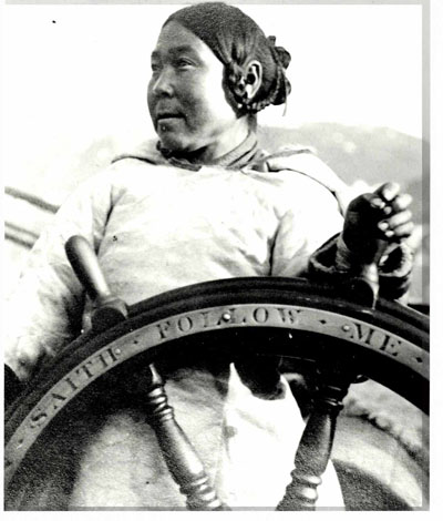Aulaqiaq, the wife of whaler and trader William Duval, stands at the wheel of the trading ship Albert. (HARPER COLLECTION)