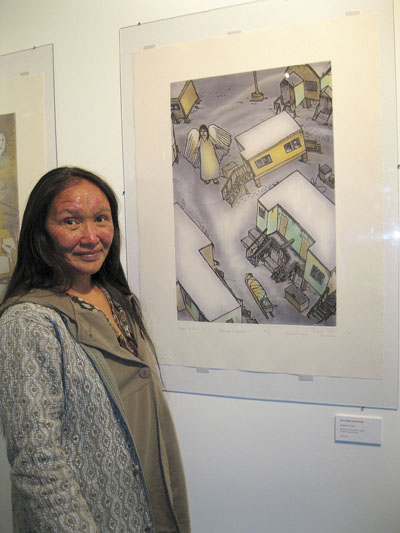 Shuvinai Ashoona welcomed visitors June 29 to the opening of Takujaksait, an exhibit of her work on display at the Nunatta Sunnakkutaangit Museum in Iqaluit for the entire summer. The print Angel in Town, shown, is one of several works Ashoona has produced in Cape Dorset. (PHOTO by PETER VARGA)