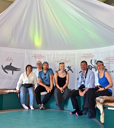 The group of travel writers and tour operators from the UK take a break on some comfortable caribou skins in the new Kuururjuaq park interpretation centre's tent exhibit. From left to right: Josephine Wiggall Lazarus from Tourism Quebec's Destination Québec office in London, U.K., David Marriott from Bridge & Wickers, Neil S. Price, photographer for Wanderlust Magazine, Phoebe Smith, editor of Wanderlust Magazine, James Butler from Audley Travel and Elizabeth Lunnon from Discover the World. (PHOTO BY ISABELLE DUBOIS/NUNAVIK TOURISM)