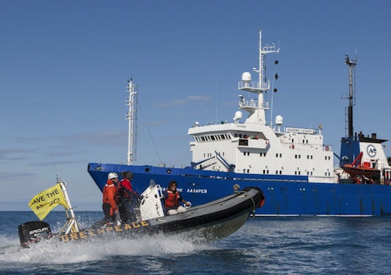 Greenpeace activists in a zodiac approach the Akademik Lazarev Aug. 13 as the vessel starts seismic testing in Arctic waters off Russia. The confrontation between activists and crew members on board the vessel leased by the Russian oil giant Rosneft is the latest in Greenpeace's efforts to halt Arctic oil and gas exploration involving seismic testing and drilling. Read more about what happened on Nunatsiaqonline.ca. (PHOTO BY WILL ROSE/ GREENPEACE)