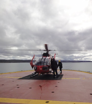 The CCGS Henry Larsen and the CCGS Amundsen will work together to recover this helicopter, shown taking off the research icebreaker in 2010, which crashed Sept. 9 near Banks Island, killing three people on board. (PHOTO BY JANE GEORGE)