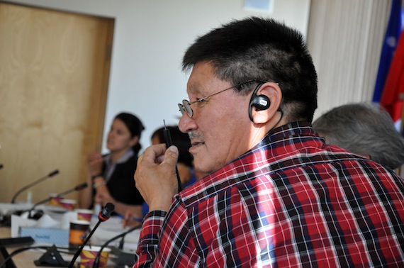 Kativik Regional Government councillor Charlie Argnak studies a piece of fibre optic cable passed around at a KRG council meeting last week in Kuujjuaq, which could possibly become the future of telecommunications in Nunavik. (PHOTO BY SARAH ROGERS)