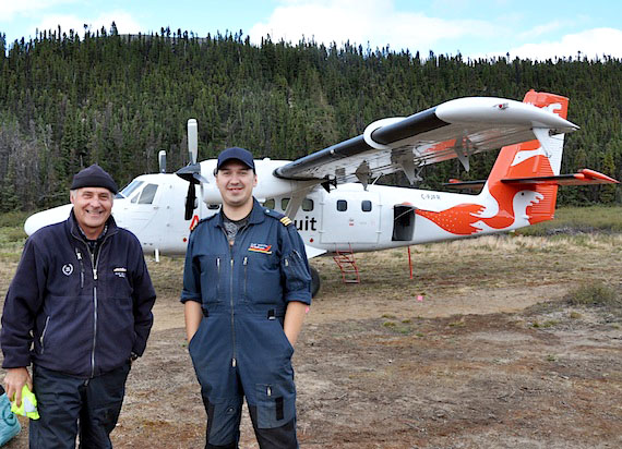 Veteran Air Inuit pilot Pierre Laplante, left, and co-pilot Mark Boulianne, right, pose in front of a Twin Otter parked on the mossy airstrip at Kuururjuaq provincial park’s base camp. A feature story by Sarah Rogers takes you on a visit to the park later on Nunatsiaqonline.ca. (PHOTO BY SARAH ROGERS)