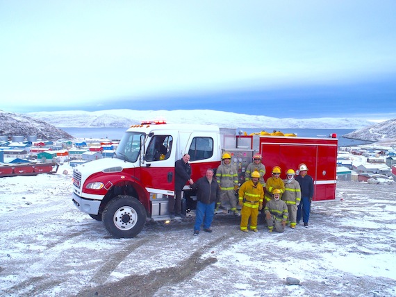 Firefighters in Salluit pose next to the community’s firetruck in this 2011 photo. Nunavik firefighters are still putting out more fires than firefighters in other Quebec regions — a problem which the KRG’s civil security hopes to tackle with the help of new statistics. (FILE PHOTO)
