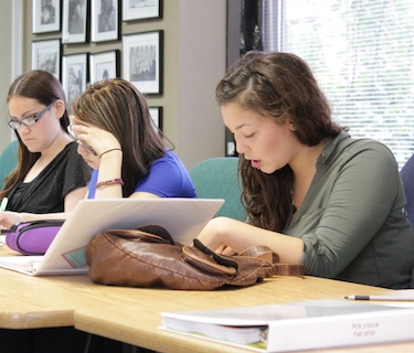 First-year Nunavut Sivuniksavut students in Daniel Guay's Contemporary Inuit Issues class read aloud the transcript of a landmark meeting of Arctic Inuit in what was then Coppermine in 1970. A jumping off point for Inuit political organization, the meeting spawned the Inuit Tapirisat of Canada in 1971, which later became  ITK. It's a great starting point for talking about land claims, Guay said. (PHOTO BY LISA GREGOIRE)
