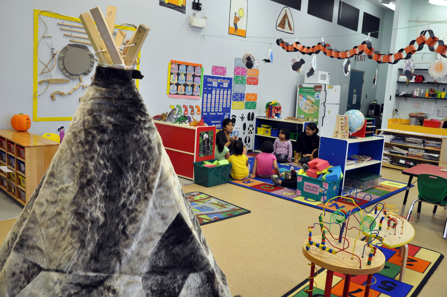 A group of preschoolers gather for circle time at the afternoon Head Start program in Arviat. The federally-funded and Aboriginal-focussed program, offered in a number of Nunavut communities, was designed to give three- and four year-olds a culturally-relevant education and boost to prepare for starting kindergarten. (PHOTO BY SARAH ROGERS) 
