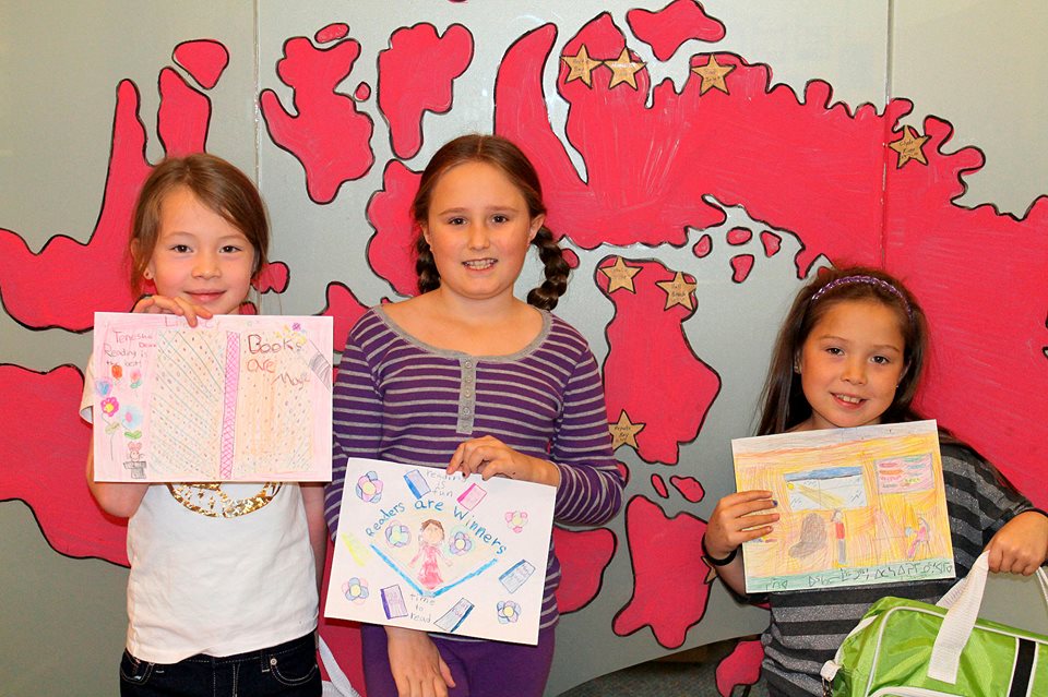From left,Tenesha Dean, Lena Chown, and Cynthia Joanasie are the winners of the Literacy Week Poster contest at Joamie Elementary School in Iqaluit. (PHOTO COURTESY OF SONJA LEBLANC)