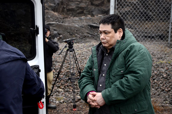 Adrian Van Eindhoven is escorted in handcuffs from the Nunavut Court of Justice in Iqaluit to a police vehicle. (PHOTO BY DAVID MURPHY)