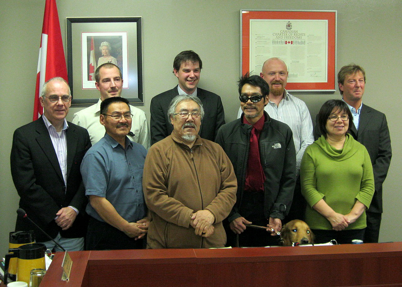 Iqaluit city council’s Nov. 12 meeting marked the first time a full complement of eight councillors and the mayor have met since Oct. 2012, thanks to the recent addition of the city’s newest councillor, Noah Papatsie, with his guide dog, Xeno, second from the right. (PHOTO BY PETER VARGA)