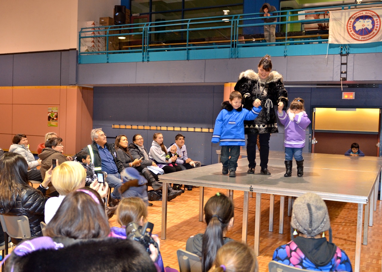 Kuujjuaq mom and seamstress Julie-Ann Berthe models her own homemade sealskin amautik Nov. 5, with her son Aakava, left, and daughter Nayaara, right - both wearing parkas she designed. The family showed off their winter wear as part of a fashion show organized by the northern village's recreation department, hosted at the Kuujjuaq Forum. (PHOTO BY ISABELLE DUBOIS) 