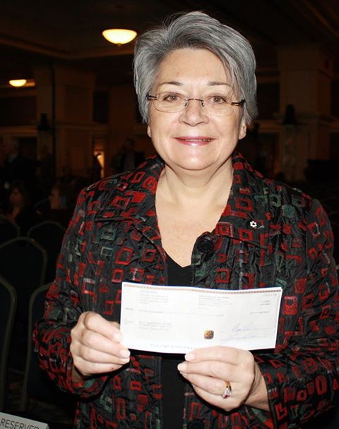 Mary Simon, chair of ITK's National Committee on Education, with the $325,000 cheque the organization received Dec. 11 as part of ArticNet's Arctic Inspiration Prize. ITK will use the money to promote parental involvement in schools throughout the four Inuit regions of the Canadian Arctic. (PHOTO COURTESY OF ITK)