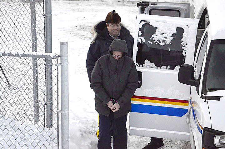 Wearing pink handcuffs, Eric Dejaeger steps out of an RCMP vehicle Jan. 20 at the Nunavut Court of Justice in Iqaluit. (PHOTO BY DAVID MURPHY) 