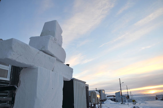 An Inuksuk made of ice blocks stands tall as the sun rises over clear skies in the east at just past 9:00 a.m. on Jan. 10 in Iqaluit — a relief from the harsh weather Iqaluit has been having for the past week. Environment Canada has sun in the forecast this weekend and extending into next week. (PHOTO BY DAVID MURPHY) 