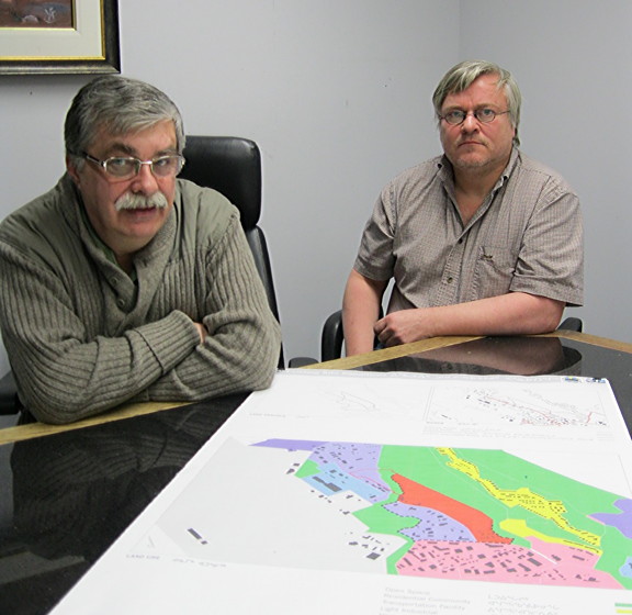 Bernie MacIsaac, left, director of lands and planning for the Qikiqtani Inuit Association, and Sheldon Nimchuk, project manager for Qikiqtaaluk Corporation, are overseeing plans to develop a 16-hectare parcel of land which promises to expand Iqaluit’s downtown core. (PHOTO BY PETER VARGA) 