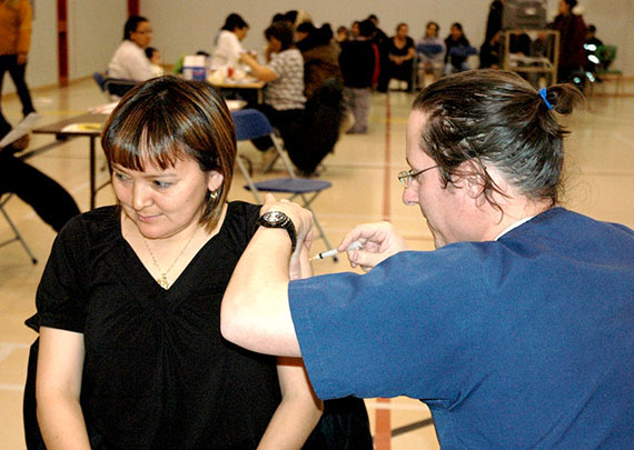 Kangiqsujuaq's then-mayor Mary Pilutrtuut receives her flu vaccine during Nunavik's 2009 H1N1 vaccine campaign. (FILE PHOTO)
