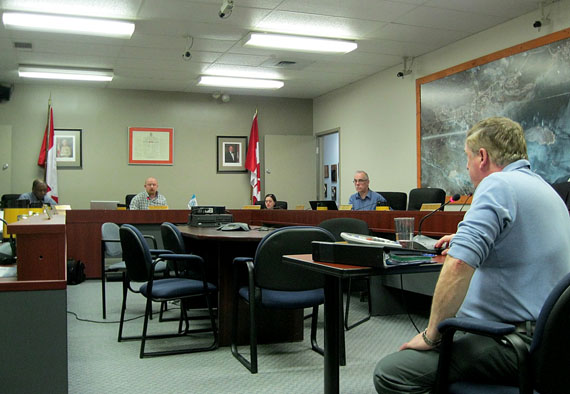 John Hussey, chief administrative officer for the City of Iqaluit, right, explains the city’s proposed budget for 2014 to the city council’s finance committee of the whole, Feb. 4. (PHOTO BY PETER VARGA)