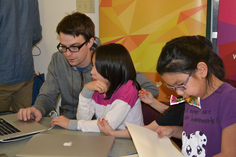 Pinnguaq's Ryan Oliver, left, works with Grace Metuq, middle, at a winter break computer programming camp in Pangnirtung Feb. 20. Myra Young, right, was another participant. (PHOTO COURTESY OF RYAN OLIVER)