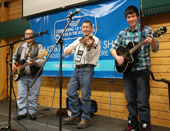 Cambridge Bay musicians David Evalik, Colin Adjun and his son Gustin, entertain a crowd Feb. 10 to kick off this year's Kitikmeot trade show in Cambridge Bay. This is the 15th year anniversary of the trade show, which runs until Feb. 12 at the community's Kiilinik High School. (PHOTO BY RED SUN PRODUCTIONS)