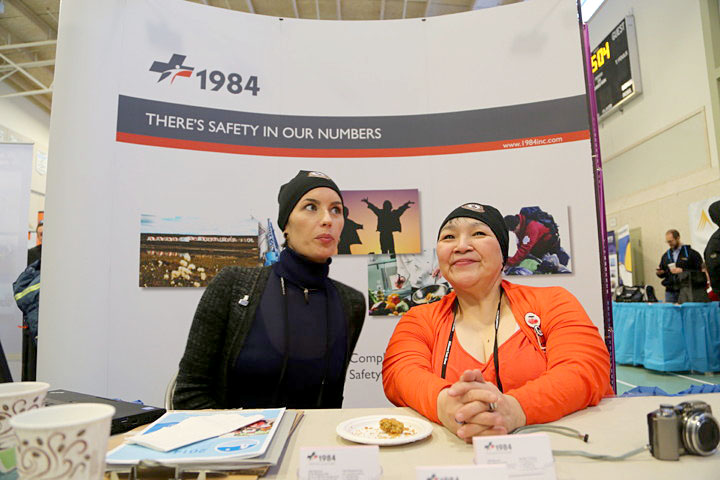 1984 Nunavut, a joint-venture company that provides camp staffing and safety services to the mining industry, was one of many companies and organizations represented at this year's Kitikmeot Trade Show. Jennifer Tompson, chief operating officer, and Navalik Helen Tologanak, president of the company, were on hand to answer questions, hand out business cards and greet potential clients at Kiilinik High School. The trade show wrapped up Feb. 12. (PHOTO BY RED SUN PRODUCTIONS)