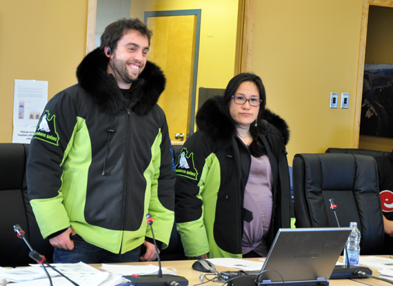 Ben Whidden, left and Nancianne Grey, of the Kativik Regional Government's recreation department, show off Team Nunavik's new parkas to the Kativik Regional Government council in Kuujjuaq Feb. 24. The parkas, complete with pointed hoods and designed by Nunavik Creations, will be worn by the 88 members of Team Nunavik's contingent that will take part in this year's Arctic Winter Games, which are being hosted in Fairbanks, Alaska March 15-22. (PHOTO BY SARAH ROGERS)