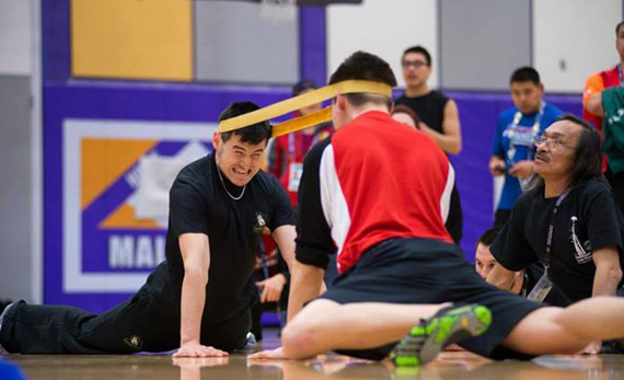 Team Nunavik-Quebec's Ahuya Snowball, 18, strains as he competes in the Open Male Head Pull March 19, at the Arctic Winter Games in Fairbanks Alaska. By the end of the competition day March 19, Team Nunavik-Quebec had amassed a total of 16 medals, while Team Nunavut had 10. (PHOTO COURTESY OF THE KRG) 