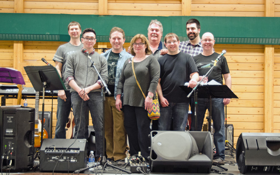Members of Cambridge Bay band Latitude 69; Jim Barta, Mason Greenly (sound), Miguel Chenier, Gary Collins, Craig LeBleu, Ryan Barry, and Terry Kee pose with Angela Phillips, front centre, at a March 29 community fundraiser. Phillips helped organize the event, which raised $5,400 for the Cross Cancer Institutes as well Women in Action 2014. Cambridge Bay mayor Jeannie Ehaloak, the event's MC, took part in last year's Women in Action - Steps of Hope, with a group who walked from Bay Chimo to Cambridge Bay. (PHOTO BY DENISE LEBLEU IMAGES)