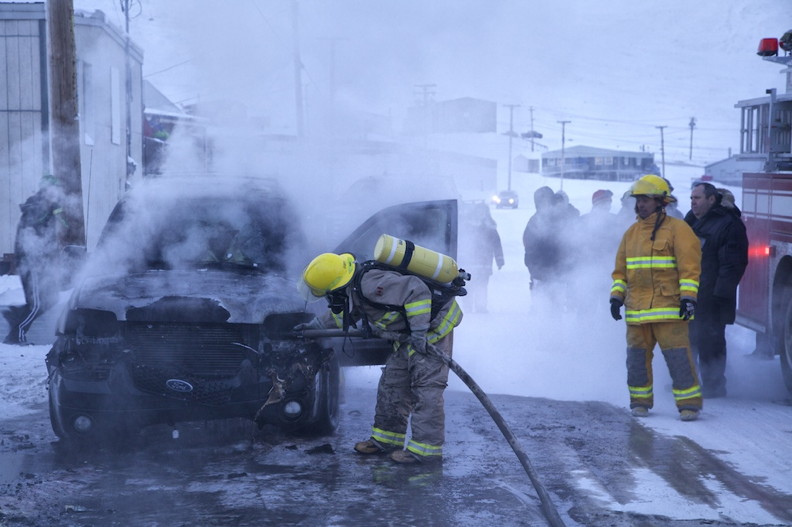 The Arctic Bay Fire Department, by-law officers and RCMP members attended to the scene of a vehicle fire Friday night in Arctic Bay. The vehicle was parked in front of a residence and was not running when the fire broke out.  There were no injuries, but the vehicle is a write-off. (PHOTO BY CLARE KINES)