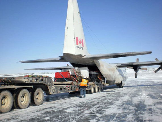 An employee of TMAC Resources Inc.’s Hope Bay gold mine project unloads two large diamond drills from a Hercules plane at the Kitikmeot mine site this week. The equipment’s arrival marks the start of the surface drilling season, which will explore how deep the mine’s Doris gold deposit goes underground. Last fall, TMAC and the Kitikmeot Inuit Association agreed to a five-year renewal of the commercial lease for the Doris North mine as well as facilities at Robert’s Bay. (PHOTO COURTESY OF TMAC RESOURCES)