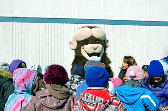 Meet Cambridge Bay's most popular resident: Ollie the Omingmak. The mascot for the community's Omingmak Frolics always attracts groups of children, who follow him wherever he goes. Here, Ollie visits with Cambridge Bay youth after the festival's opening parade May 16.The Frolics wrapped up May 19. (PHOTO BY DENISE LEBLEU IMAGES)