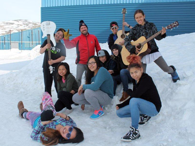 Youth Fusion music instructors Geneviève Bernier and Alan Dicknoether pose with their music students outside of Ikusik school in Salluit. (PHOTO COURTESY OF YOUTH FUSION)
