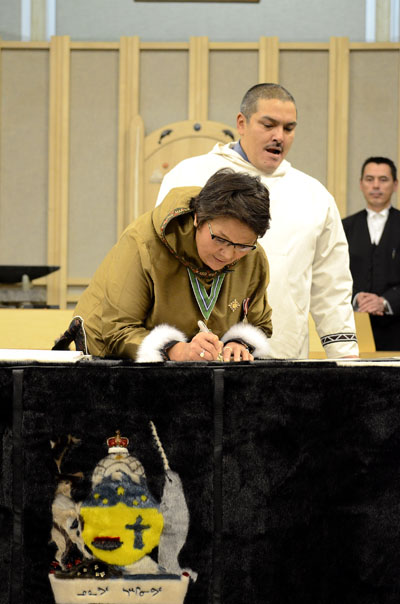 Uqqummiut MLA Samuel Nuqingaq stifles a yawn at a swearing-in ceremony for new Nunavut MLAs Nov. 19. (FILE PHOTO)
