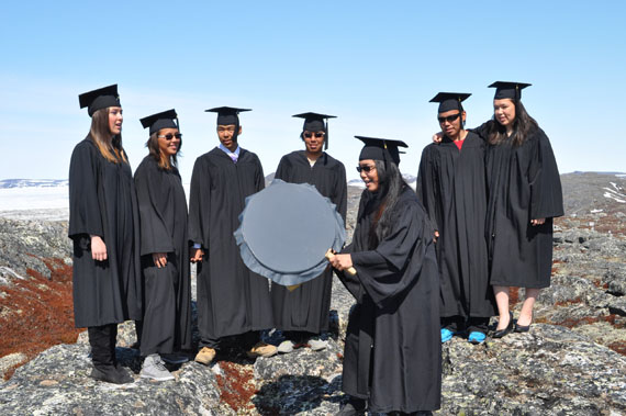 Pending exams and term 3 assignments, these are the 2014 graduates from Kangiqsualujjuaq's Ulluriaq school, posing in their gowns near Ungava Bay last week. From left: Andrea Brazeau, Eileen Emudluk, Donald Etok, Nicolas Annanack, Maasa Ittulak on the drum, Traugott Annanack and Julia St. Aubin. High school students across Nunavik are gearing up for graduation ceremonies later this month. (PHOTO BY MCCOMBIE ANNANACK)