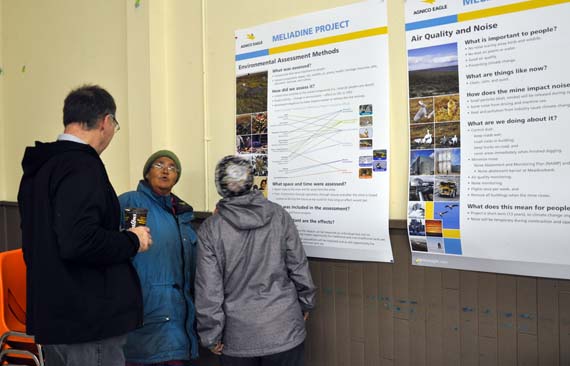 Stéphane Robert, manager of regulatory affairs at Agnico Eagle Mines, answers questions from two elders in Rankin Inlet June 18. The company is hosting an open house to explain its Meliadine project to residents, followed by a presentation this evening at 7:00 p.m. at the community's arena. This is AEM's first stop on an open house tour of communities across the Kivalliq, since it submitted Meliadine's final environmental impact statement in May. (PHOTO BY SARAH ROGERS) 