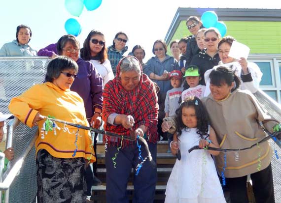 Early childhood educator Elisapi Weetaluktut, second from left, cuts the ribbon at the opening of the new Natturaq childcare centre in Inukjuak last month, with the help of young Lydia Suasi Kasudluak, second from right. The 65-place facility is the second childcare centre for the Nunavik community. Salluit, Puvirnituq and Kangiqsualujjuaq also saw their second childcare centres built this year, while Kuujjuaq has applied to the Quebec government for funding to open its third centre. (PHOTO COURTESY OF THE KRG)