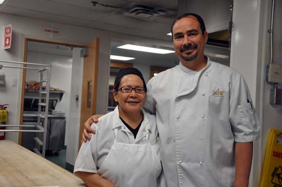 Veteran cook-help Betty Matautuaaq with Meadowbank’s first cook Eric Laurent St-Louis in the mine site’s kitchen June 23. (PHOTO BY SARAH ROGERS) 