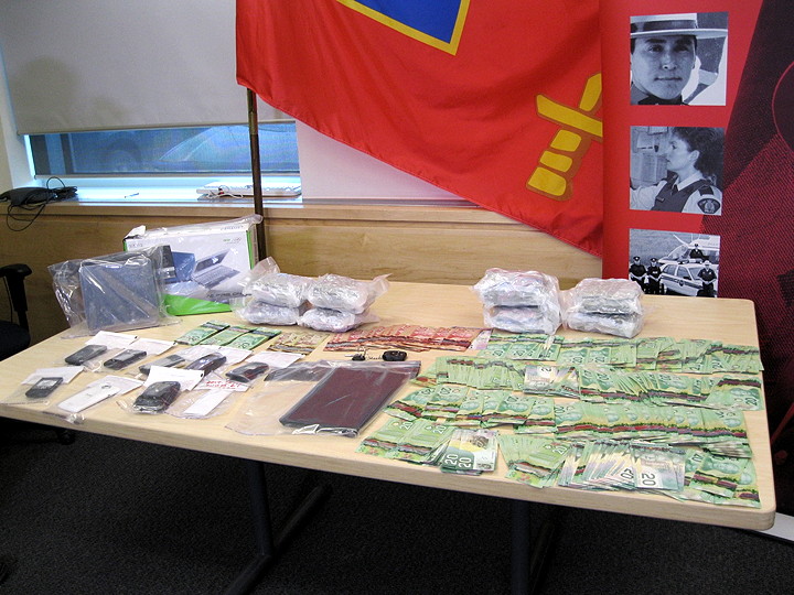 RCMP’s V division in Iqaluit announced, June 3, the arrest of two men at a private residence in the city, and the subsequent seizure of seven pounds of marijuana (3,175 grams), pictured, in a May 27 drug bust. Also seized were $16,500 in cash, eight cellphones, a laptop and weighing scale. Police charged one man with possession for the purpose of trafficking and resisting arrest, and a second on counts of trafficking and possession of “property obtained through crime,” said Sgt. Yvonne Niego. Police made the arrests and seizures after a six-month investigation and suspect the drugs were meant for resale in Iqaluit. (PHOTO BY PETER VARGA)
