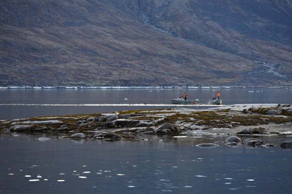 A search and rescue team including two divers from Qikiqtarjuaq headed out along the shore of Pangnirtung June 30. The divers were brought in to help recover the body of Eric Joamie, a local man who has been missing since June 19. The search has since been called off. (PHOTO BY DAVID KILABUK)