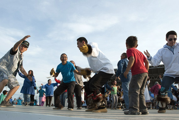 The Tuktoyaktuk Siglit Drummers and Dancers got the crowd moving at Jim Koe Park in Inuvik, Northwest Territories July 21. That community is hosting the Inuit Circumpolar Council's general assembly this week until July 24, a gathering of Inuit organizations from across Canada, the United States, Greenland and Russia. (PHOTO BY NATHALIE HEIBERG-HARRISON)