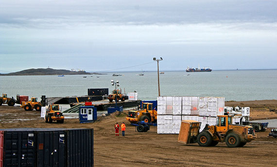 Iqaluit’s sealift beach buzzes with activity at high tide Aug. 16, as forklifts unload sealift cargo. The GN is asking residents to stay clear of unloading areas to avoid accidents with heavy machinery. (PHOTO BY PETER VARGA)