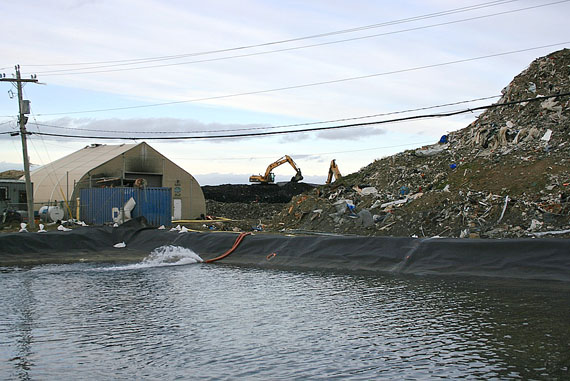 A settling pond at Iqaluit’s dump collects waste water run-off from fresh water sprayed onto the smouldering garbage pile Sept. 14. The fire was extinguished Sept. 16. (PHOTO BY PETER VARGA)