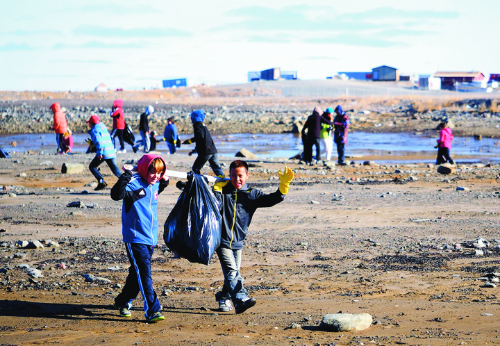 Beachy clean: students and staff from Simon Alaittuq School in Rankin Inlet take part in the annual Canadian Shoreline Cleanup campaign Sept. 22. The beach cleanup program occurs across the country every third week of September in every province and territory—from large urban centres to small remote communities. According to the campaign's website, 58,500 Canadians collected nearly 100,000 kgs of trash in 2013. That year, the largest portion of Nunavut trash collected was