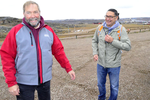 Opposition leader Thomas Mulcair and Romeo Saganash, the NDP MP for Abitibi-James Bay-Nunavik-Eeyou, after they finished an ATV tour of Sylvia Grinnell Park on the morning of Sept. 4 at the end of their three-day visit to Iqaluit, which included a day of meetings Sept. 3. “Mr. Harper likes coming in here for photo-ops, but the Arctic and the North require a lot more than just photo-ops. They require long-term attention and serious planning,” Mulcair told reporters. Read more later on nunatsiaqonline.ca. (PHOTO BY JIM BELL)
