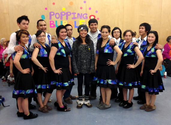 Ariel Tweto, centre, poses with the Northern Lights dancers in Taloyoak Sept. 23 during a community feast and dance in the Kitikmeot community. The Inupiaq reality TV star  is currently touring western Nunavut with her Popping Bubbles tour, which touches on suicide prevention and goal-setting. (PHOTO COURTESY OF POPPING BUBBLES) 